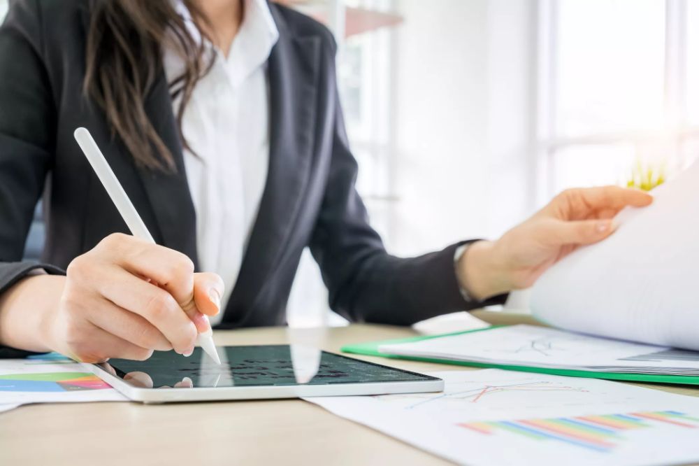 Notebook and simple financial notes on a desk
